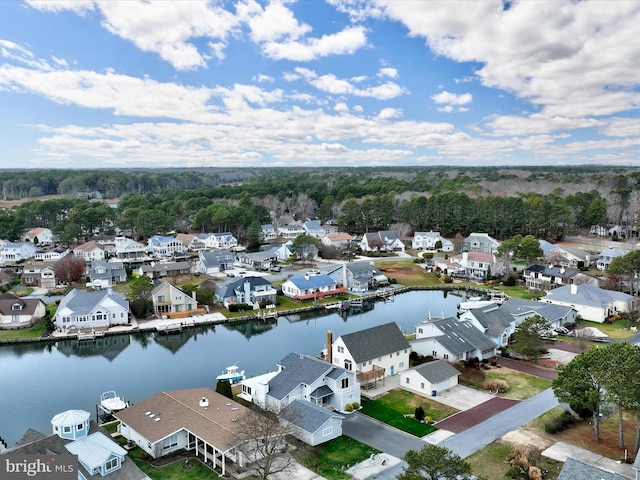 drone / aerial view featuring a water view and a residential view