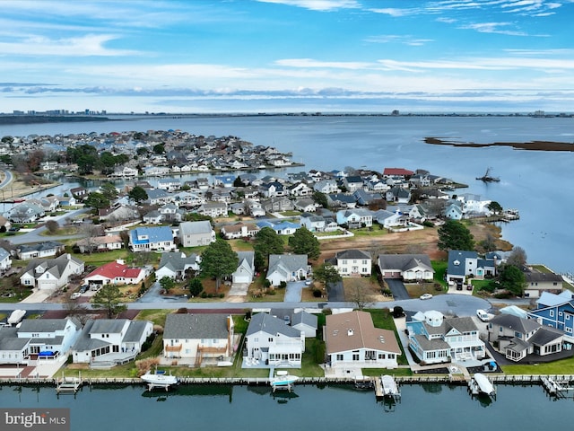 birds eye view of property featuring a water view and a residential view