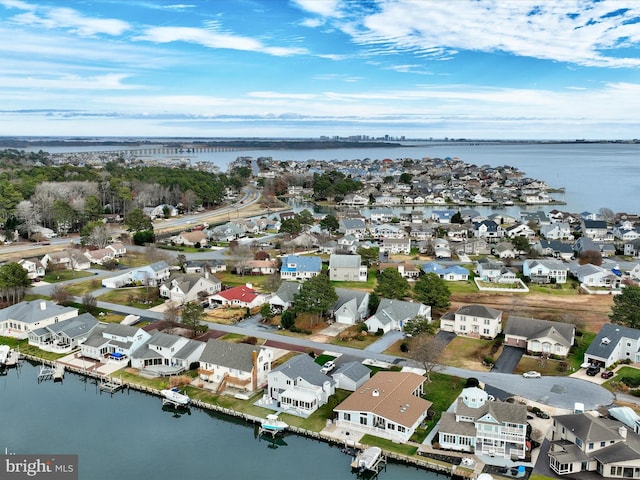 aerial view with a water view and a residential view