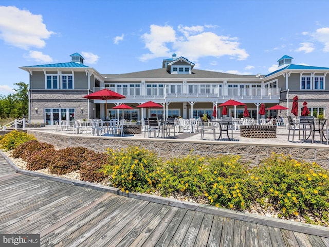 back of property with a patio