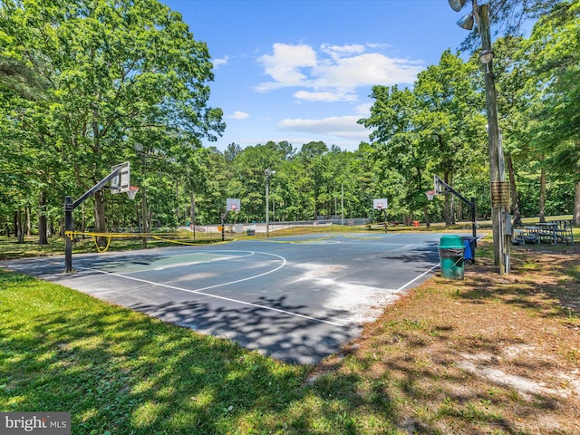 view of basketball court featuring a yard and community basketball court