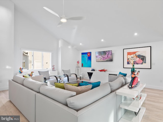 living area featuring baseboards, a ceiling fan, light wood-type flooring, high vaulted ceiling, and recessed lighting