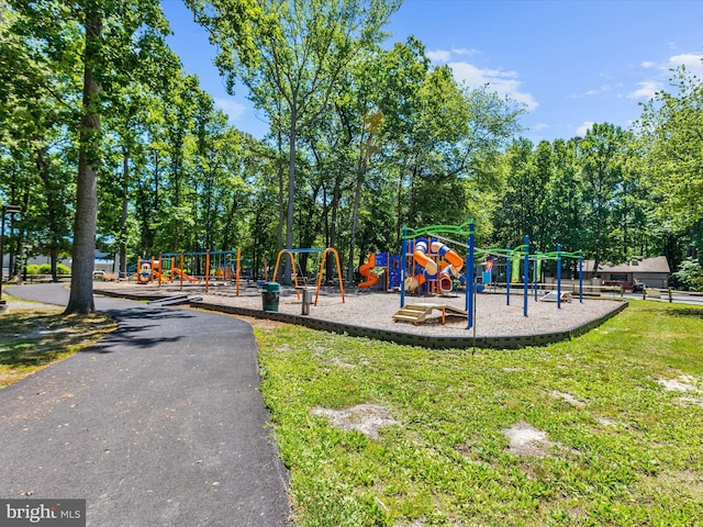 community play area with a lawn