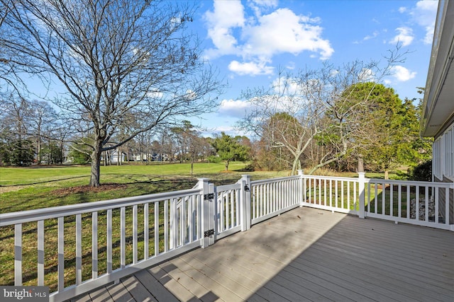 deck featuring a lawn