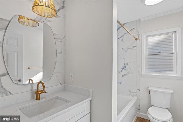 bathroom with bathtub / shower combination, vanity, and toilet