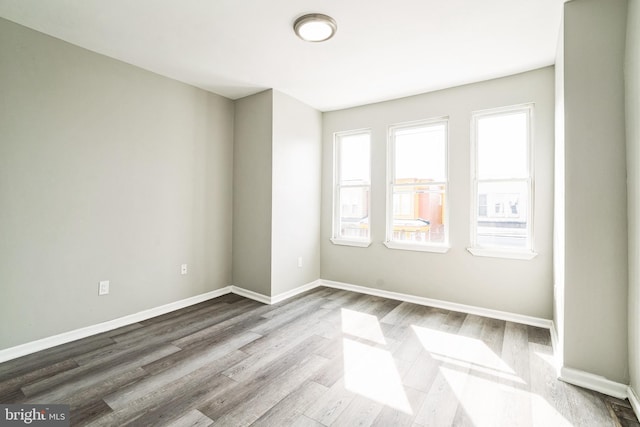 5717 Addison St, Philadelphia, PA 19143 - unfurnished room featuring wood finished floors and baseboards