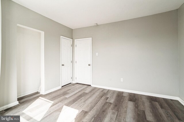 5717 Addison St, Philadelphia, PA 19143 - unfurnished bedroom featuring wood finished floors and baseboards