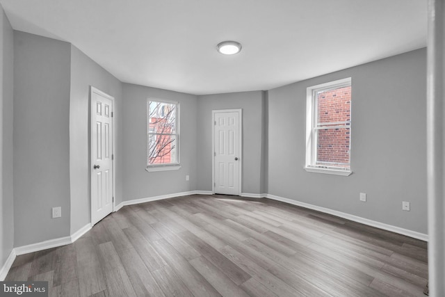 5717 Addison St, Philadelphia, PA 19143 - empty room featuring wood finished floors and baseboards