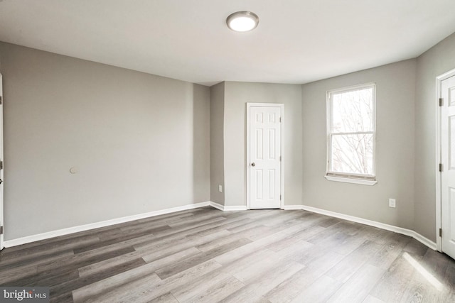 5717 Addison St, Philadelphia, PA 19143 - unfurnished bedroom featuring wood finished floors and baseboards