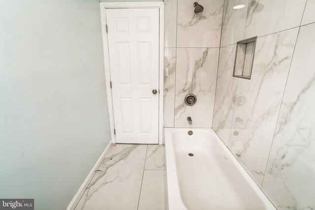 5717 Addison St, Philadelphia, PA 19143 - full bath with baseboards, marble look tiles, and bathing tub / shower combination