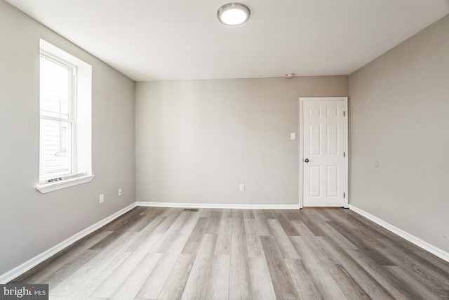 5717 Addison St, Philadelphia, PA 19143 - empty room with wood finished floors and baseboards