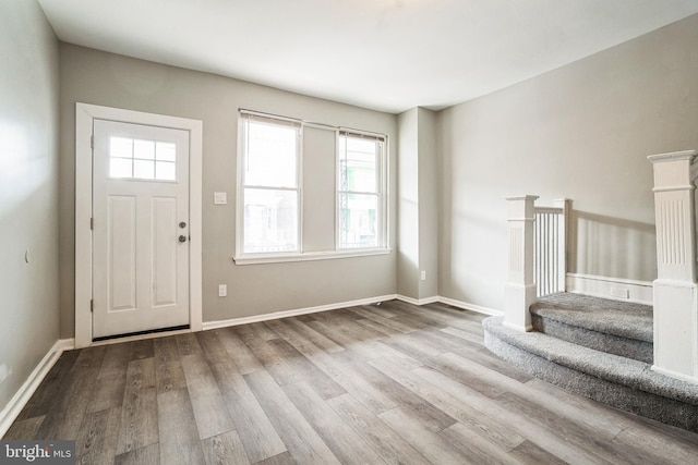 5717 Addison St, Philadelphia, PA 19143 - foyer entrance with wood finished floors, stairway, and baseboards
