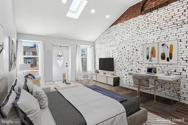 bedroom with a skylight, multiple windows, wood finished floors, and recessed lighting