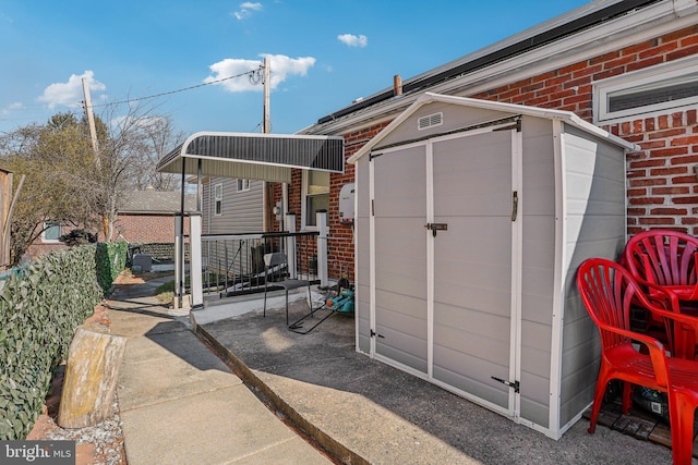 view of shed with fence