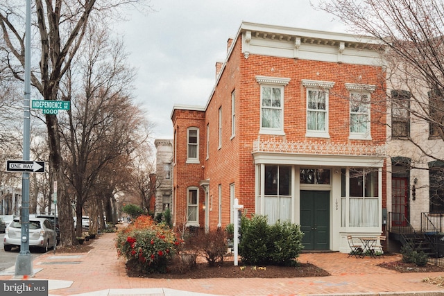 view of front of house with brick siding