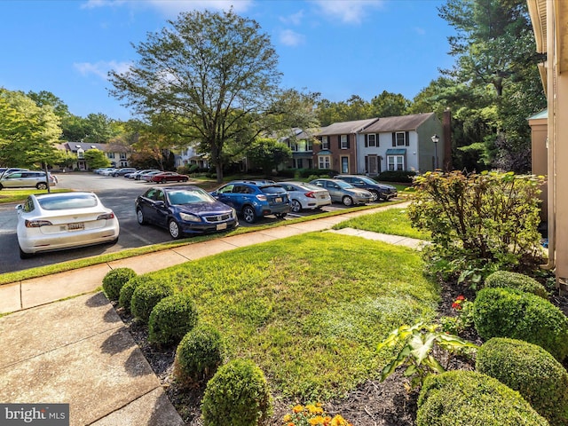 view of vehicle parking featuring a residential view