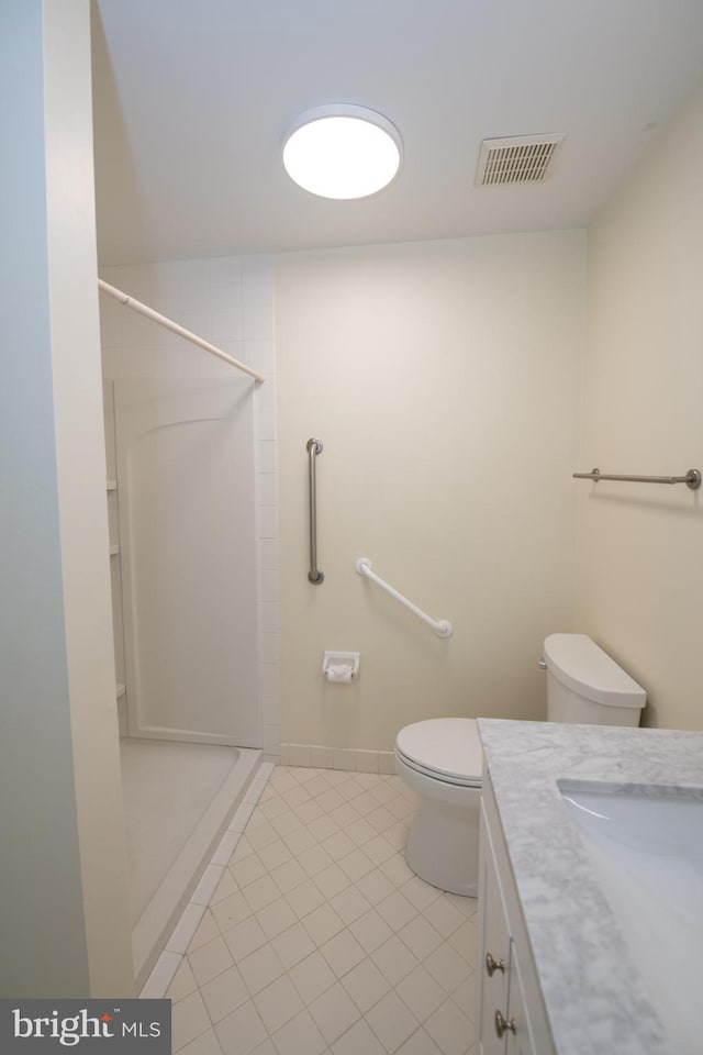 full bathroom with tile patterned flooring, toilet, vanity, visible vents, and a stall shower