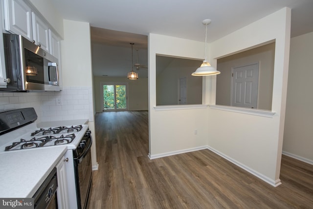 kitchen with baseboards, decorative backsplash, dark wood-style floors, light countertops, and black appliances