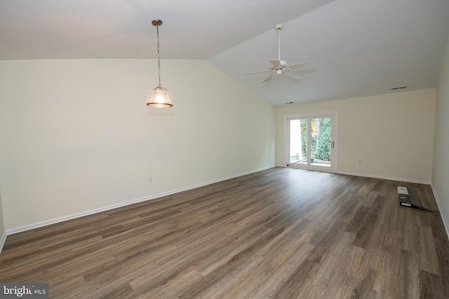 interior space featuring lofted ceiling, ceiling fan, visible vents, baseboards, and dark wood finished floors