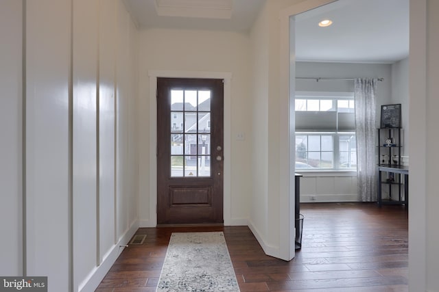 entrance foyer with recessed lighting, dark wood-type flooring, and baseboards