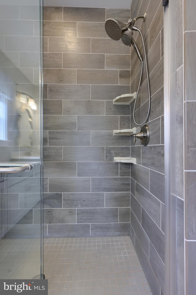 bathroom with a shower stall