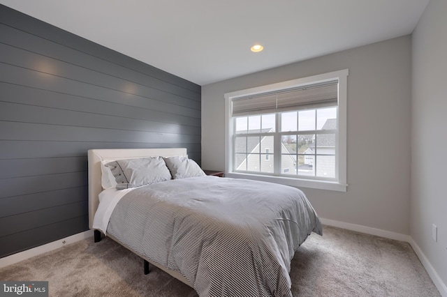 carpeted bedroom featuring baseboards