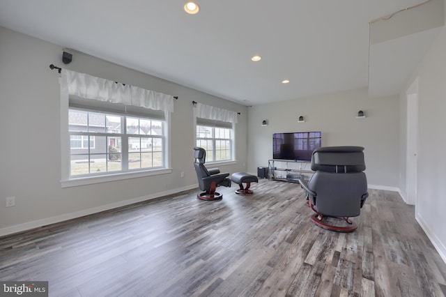 interior space featuring recessed lighting, baseboards, and wood finished floors