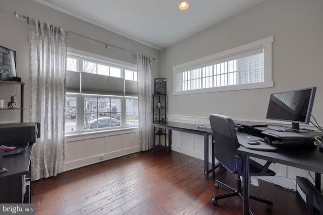 home office featuring a wealth of natural light, visible vents, recessed lighting, and dark wood-style flooring