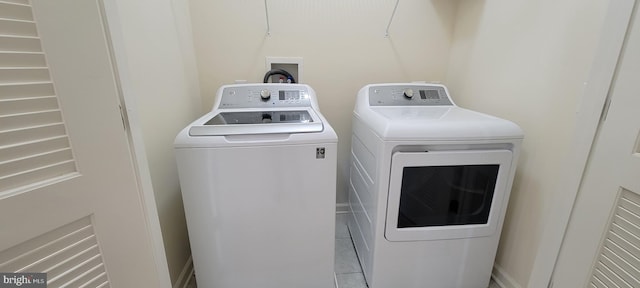 clothes washing area featuring laundry area and separate washer and dryer