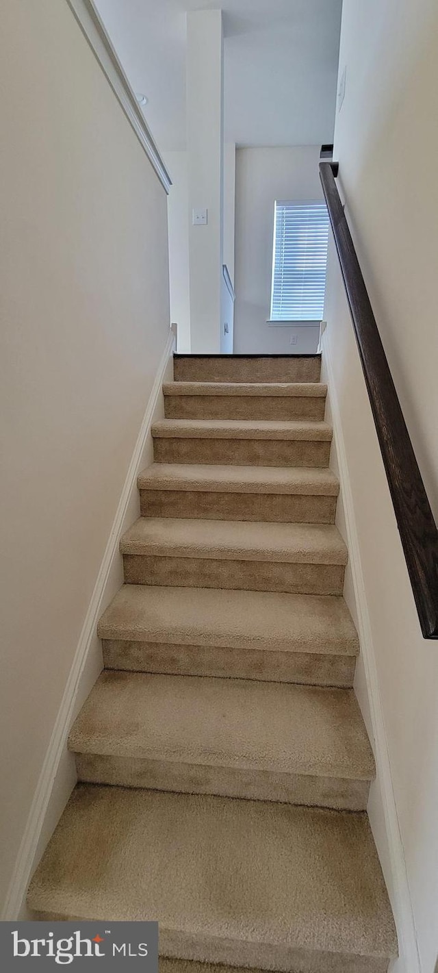 stairway with baseboards