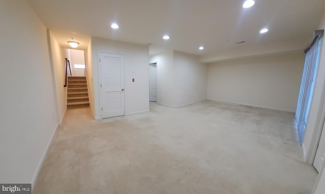 interior space with recessed lighting, baseboards, and stairs