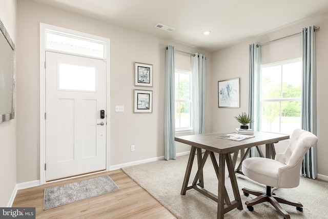 entryway with light wood-style flooring, recessed lighting, visible vents, and baseboards