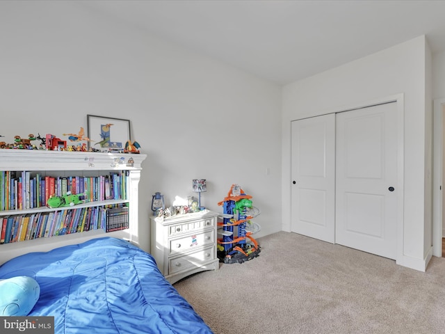 carpeted bedroom featuring a closet