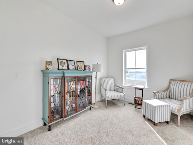 living area with carpet flooring and baseboards