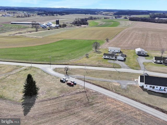 birds eye view of property with a rural view