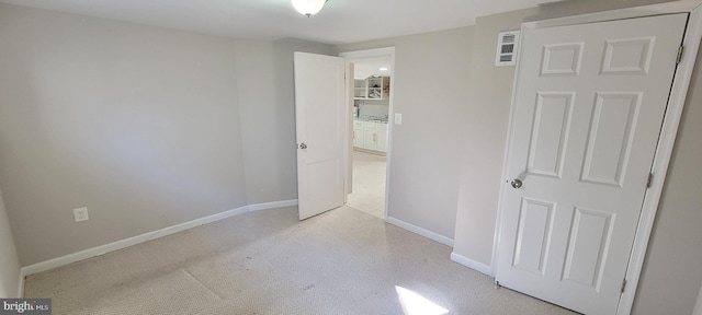 unfurnished bedroom featuring baseboards