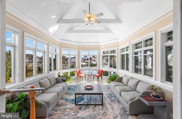 sunroom featuring a wealth of natural light, beamed ceiling, and a ceiling fan