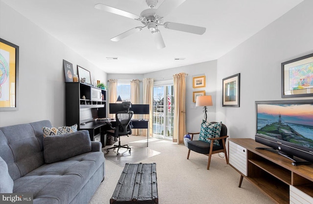 office with carpet flooring and ceiling fan