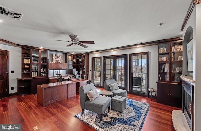 office featuring visible vents, french doors, dark wood-type flooring, and ornamental molding