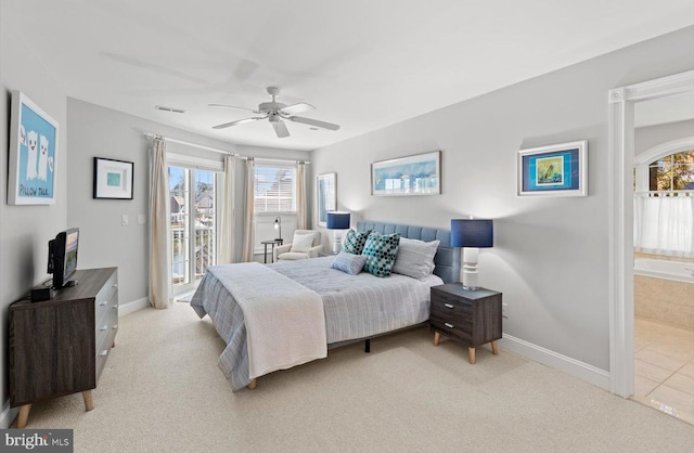 bedroom featuring access to outside, light colored carpet, visible vents, and baseboards