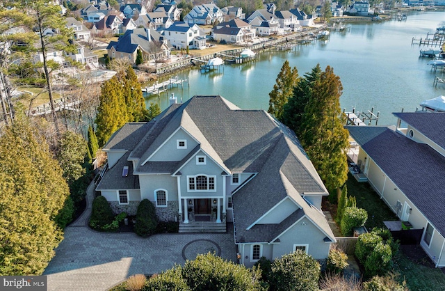 birds eye view of property featuring a residential view and a water view