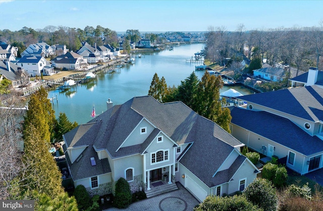 bird's eye view featuring a residential view and a water view