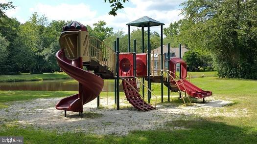 community play area featuring a lawn