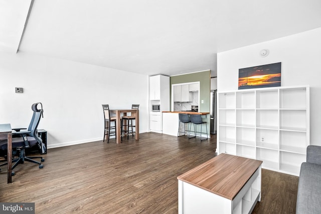 living room featuring dark wood-style floors and baseboards