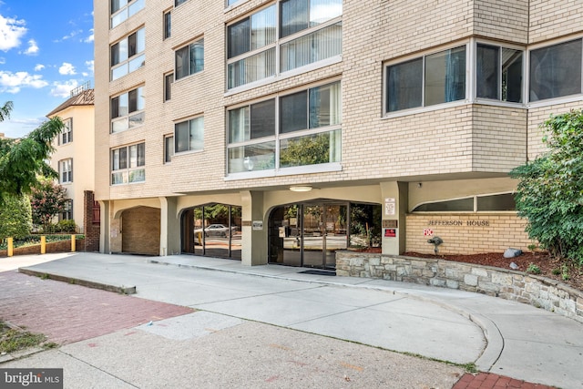 view of property with concrete driveway