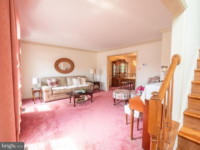 carpeted living room featuring stairway and crown molding