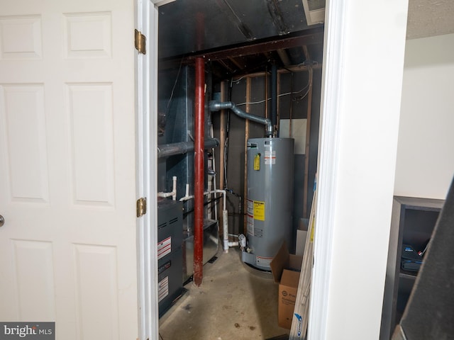 utilities with gas water heater and visible vents