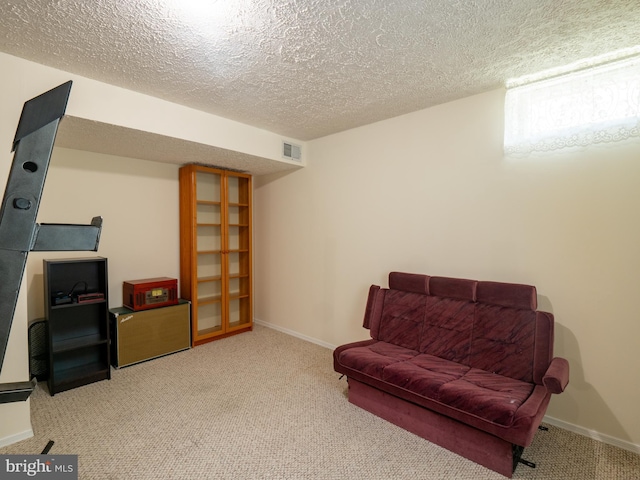 sitting room featuring carpet, visible vents, and baseboards