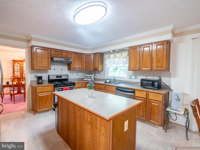 kitchen featuring stainless steel appliances, brown cabinets, and under cabinet range hood