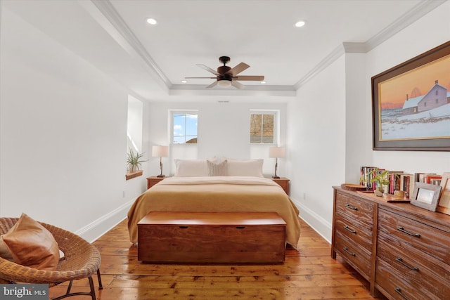 bedroom featuring baseboards, light wood-type flooring, and crown molding